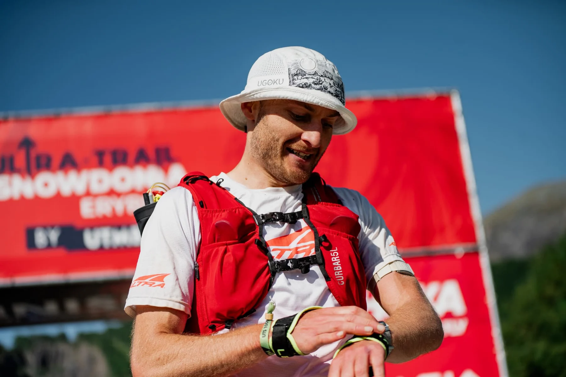 Keith checking his watch at the finish line